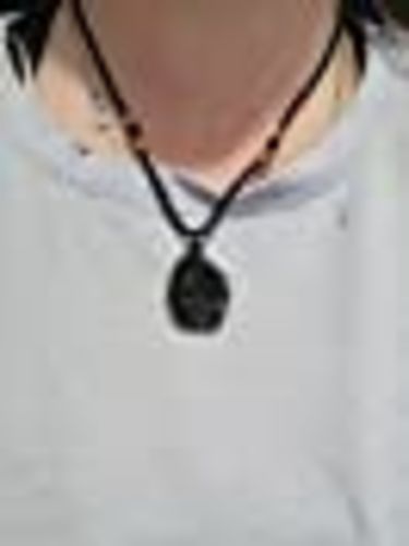 Customer photo review of Moldavite Pendant Necklace for Spiritual Awakening & Transformation.