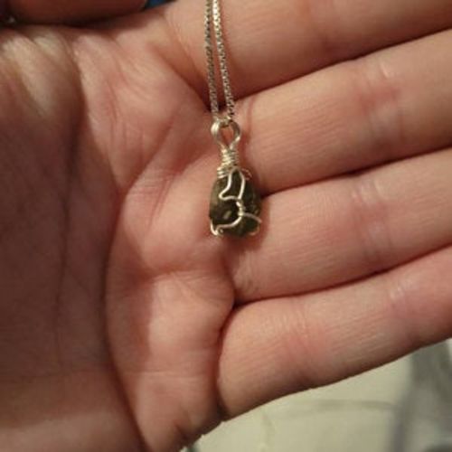 Customer photo review of Moldavite Pendant Necklace for Spiritual Awakening & Transformation.