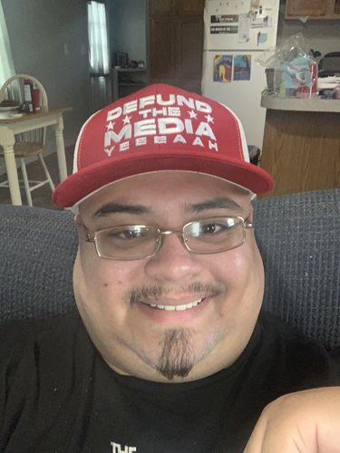 Customer photo review of Defund The Media Trucker Hat