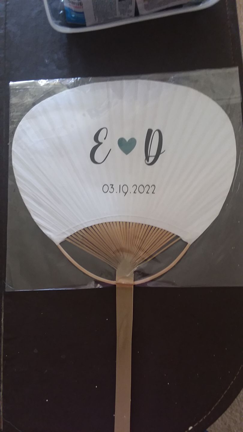 Customer photo review of 9" White Paddle Paper Hand Fans for Weddings (10 Pack)