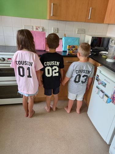 Customer photo review of Cousin Squad Number Tees