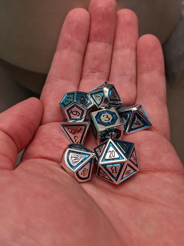 Customer photo review of CLERIC'S DOMAIN AQUA AND SILVER METAL DICE SET