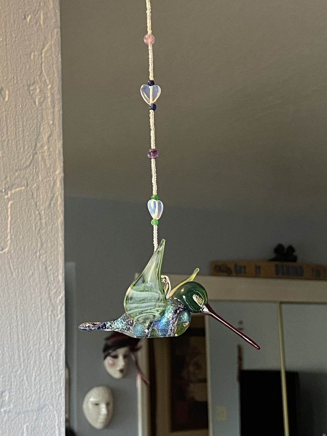 Customer photo review of Dichroic Twist Glass Hummingbird with Infused Ash