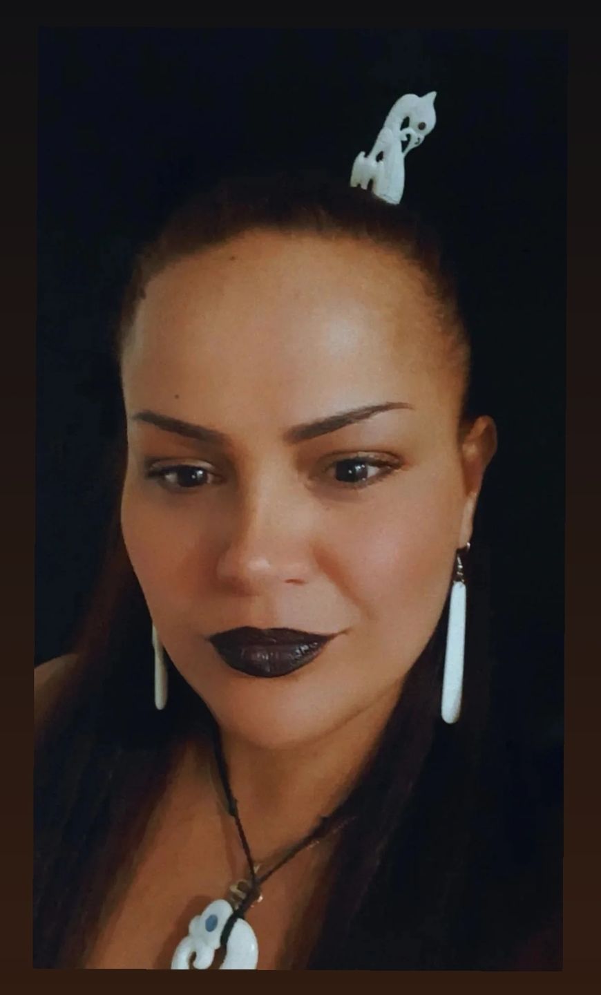 Customer photo review of Long Maori Bone Earrings with Koru Surface Carving