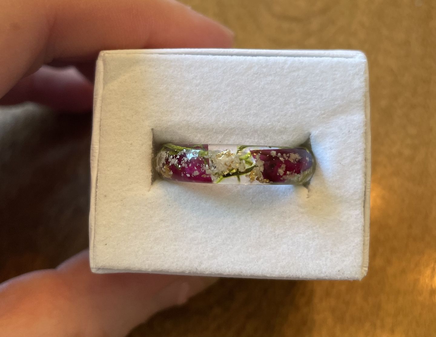 Customer photo review of Red Rose Moss Ring with Cremation Ash and Gold Flakes