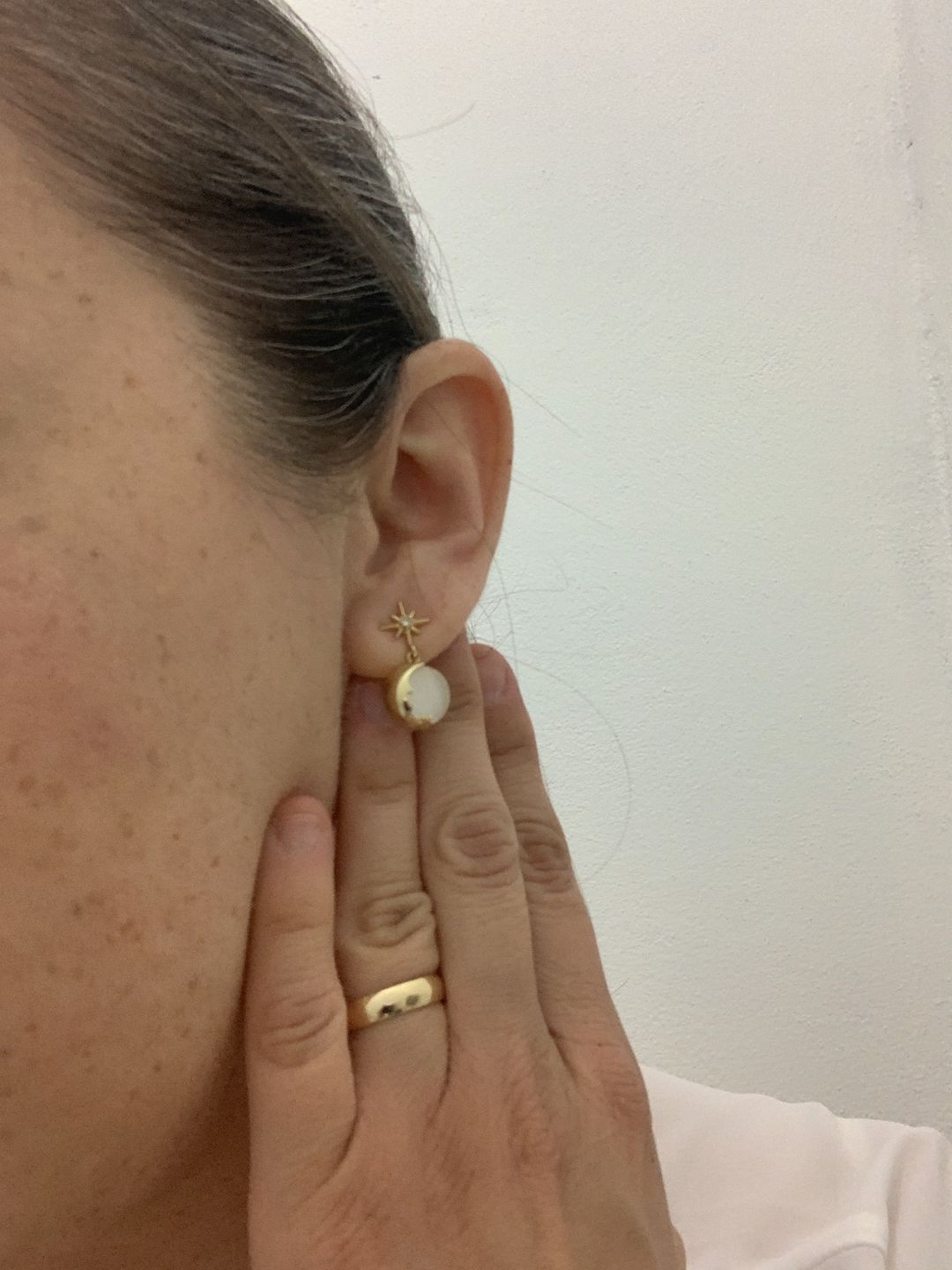 Customer photo review of Aretes de Saturno de Ópalo
