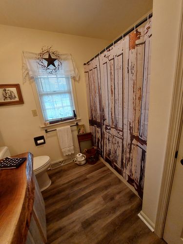 Customer photo review of White Wooden Plank Rustic Barn Door Shower Curtain