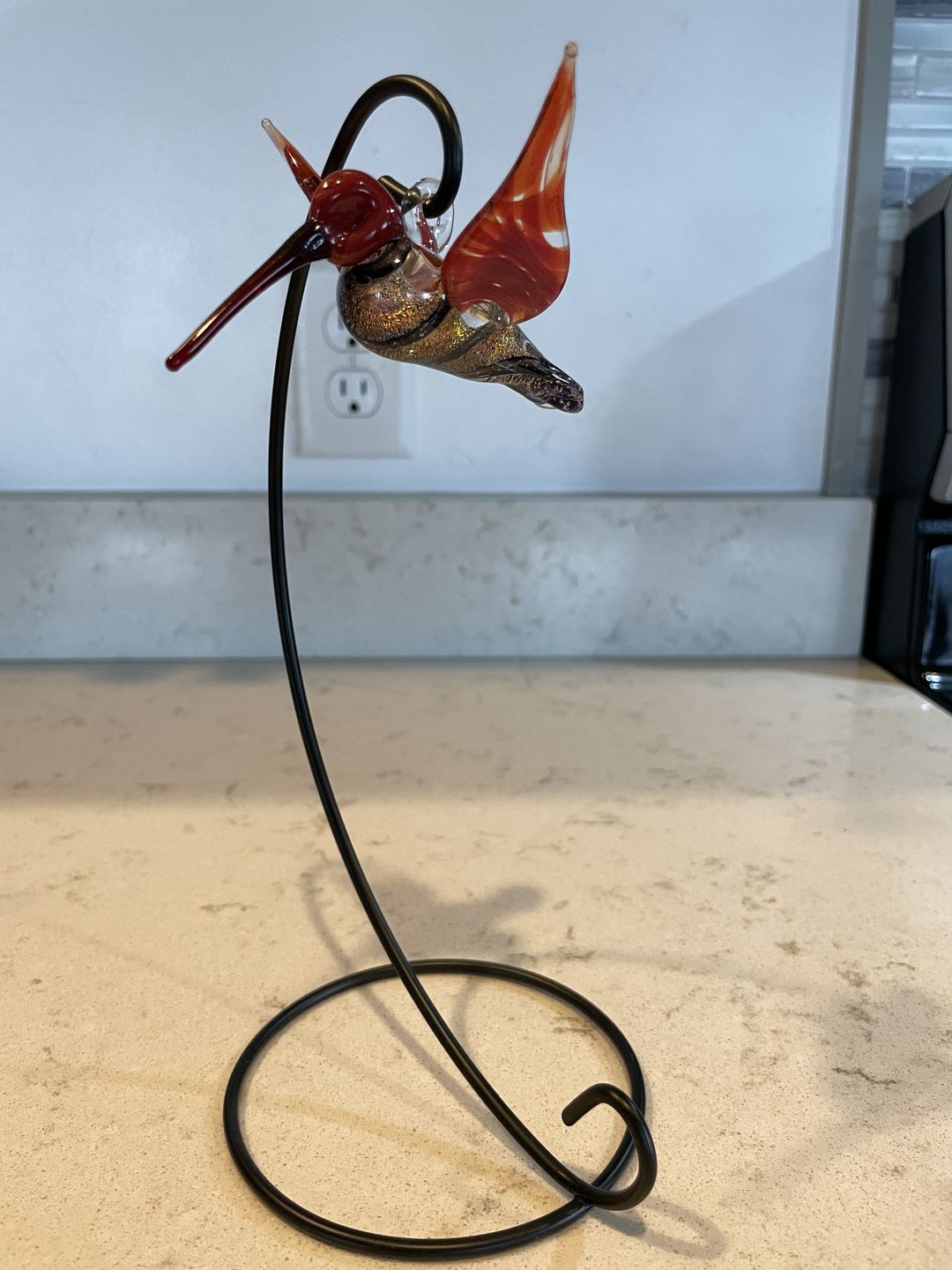Customer photo review of Red Dichroic Twist Glass Hummingbird with Infused Ash