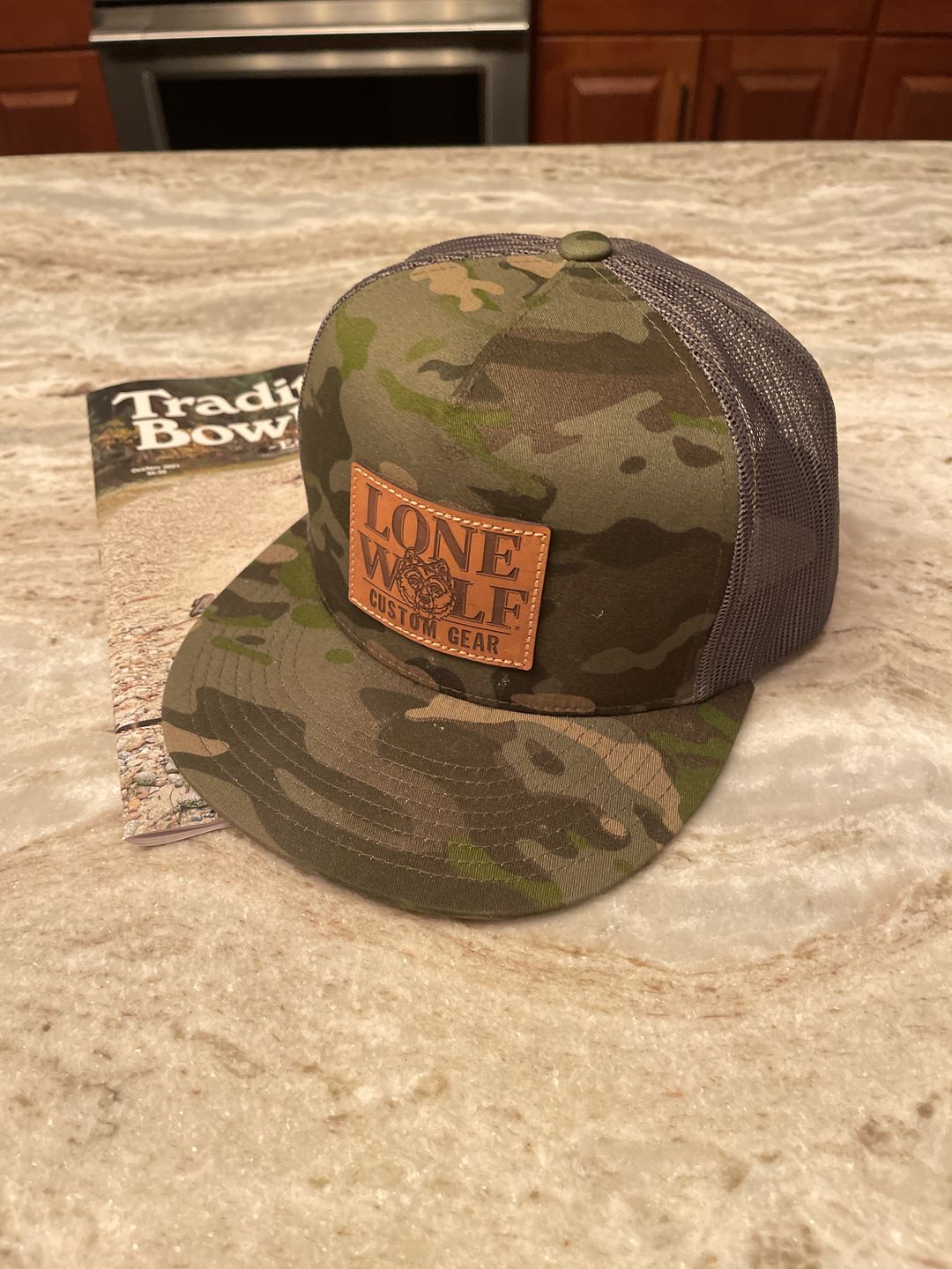 Customer photo review of Lone Wolf Custom Gear Flat Bill Trucker Hat