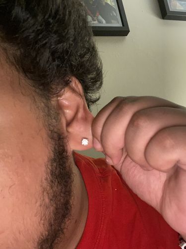 Customer photo review of VVS Moissanite Solitaire Stud Earrings
