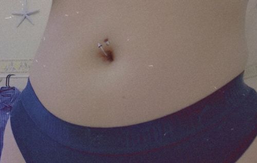 Customer photo review of Spiral Twister Belly Button Piercing