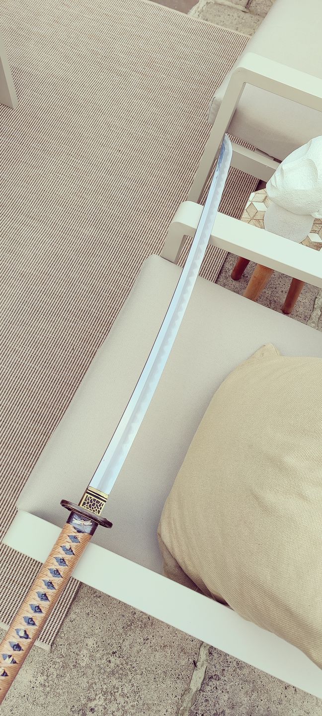 Customer photo review of Authentic Japanese Samurai Swords Katana Blade RaySkin Wrapped Saya