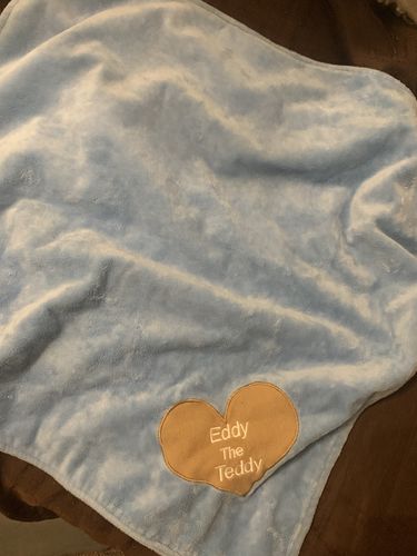 Customer photo review of Eddy The Teddy Snuggle Blanket