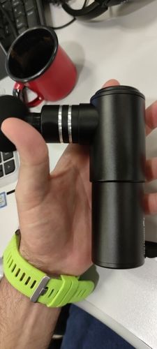 Customer photo review of BOOSTER Mini Massage Gun with 4 Heads For Muscle Relaxation