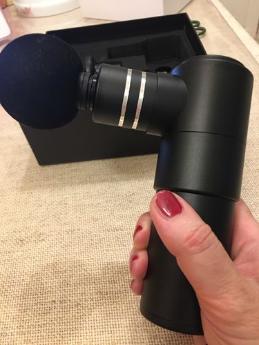 Customer photo review of BOOSTER Mini Massage Gun with 4 Heads For Muscle Relaxation