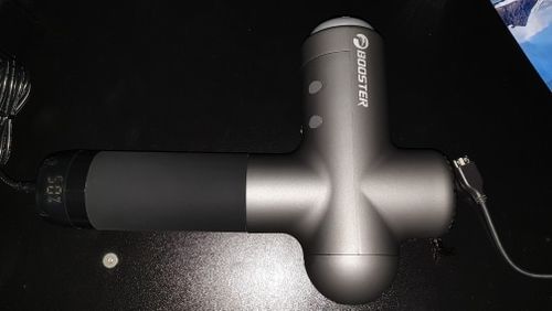 Customer photo review of BOOSTER Premium Recovery Massage Gun With 6 Massage Heads - Smart Hit Technology