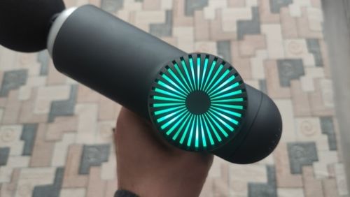 Customer photo review of BOOSTER Premium Recovery Massage Gun With 6 Massage Heads - Smart Hit Technology