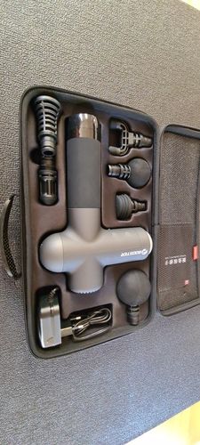 Customer photo review of BOOSTER Premium Recovery Massage Gun With 6 Massage Heads - Smart Hit Technology