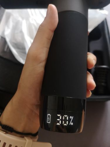 Customer photo review of BOOSTER Premium Recovery Massage Gun With 6 Massage Heads - Smart Hit Technology