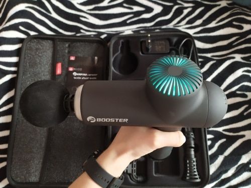 Customer photo review of BOOSTER Premium Recovery Massage Gun With 6 Massage Heads - Smart Hit Technology