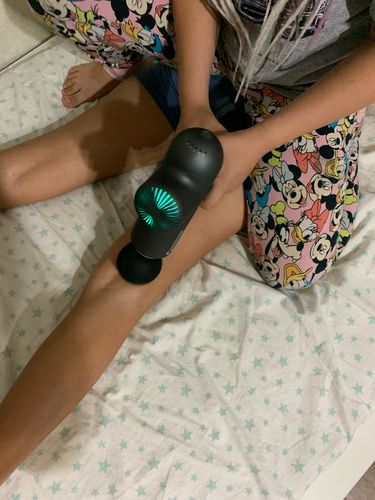 Customer photo review of BOOSTER Premium Recovery Massage Gun With 6 Massage Heads - Smart Hit Technology