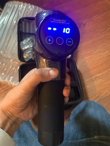 Customer photo review of LCD Display Massage Gun With Touch Screen 20 Speed & 4 Heads