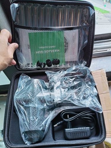 Customer photo review of LCD Display Massage Gun With Touch Screen 20 Speed & 4 Heads
