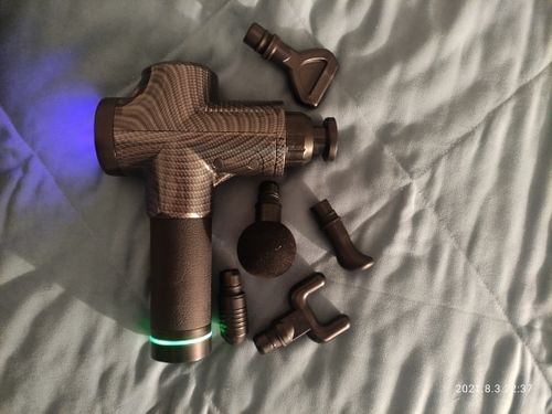 Customer photo review of LCD Display Massage Gun With Touch Screen 20 Speed & 4 Heads