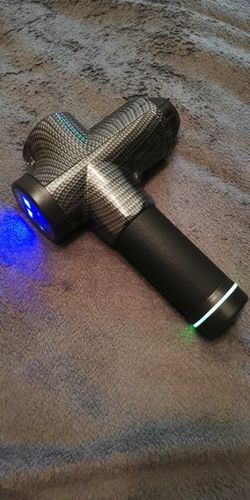 Customer photo review of LCD Display Massage Gun With Touch Screen 20 Speed & 4 Heads