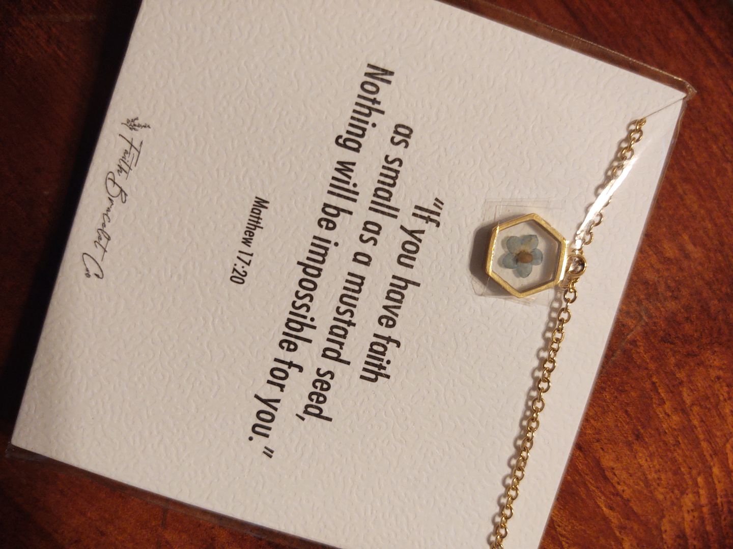 Customer photo review of Matthew 17:20 Forget Me Not Necklace