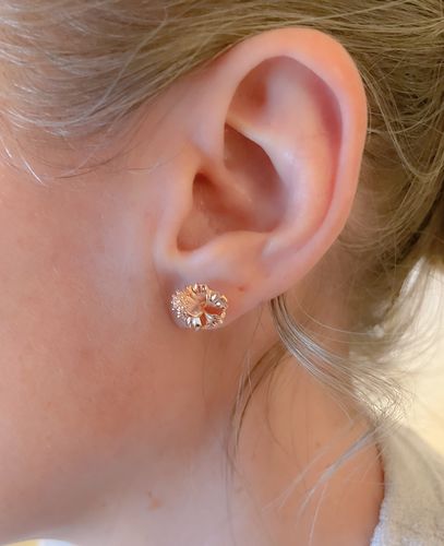 Customer photo review of 18mm Plumeria Sterling Silver Rhodium Three CZ Stud Earring