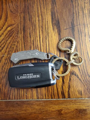 Customer photo review of Brass Octopus Tentacle Keychain