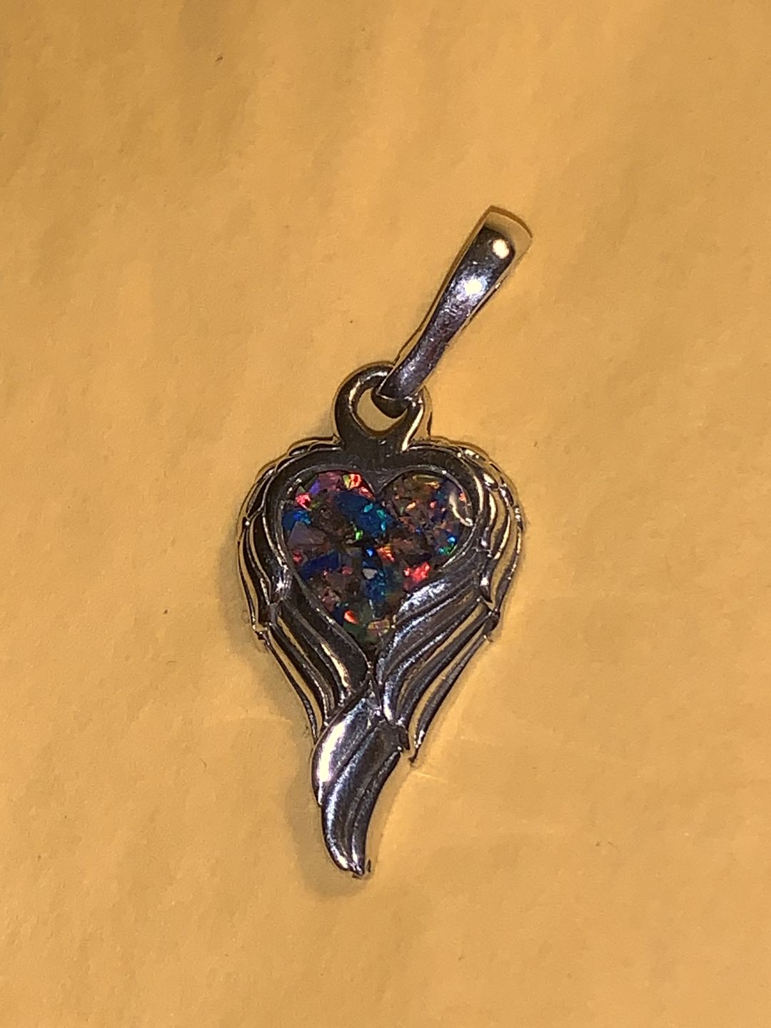 Customer photo review of Petite Angel Wing Pendant - Engravable