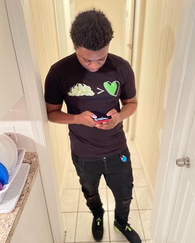 Customer photo review of LOVE ME NOW TEES