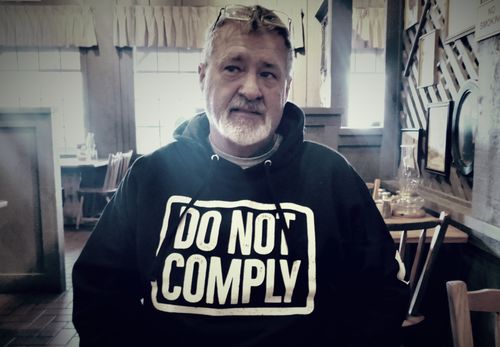 Customer photo review of Do Not Comply Hoodie