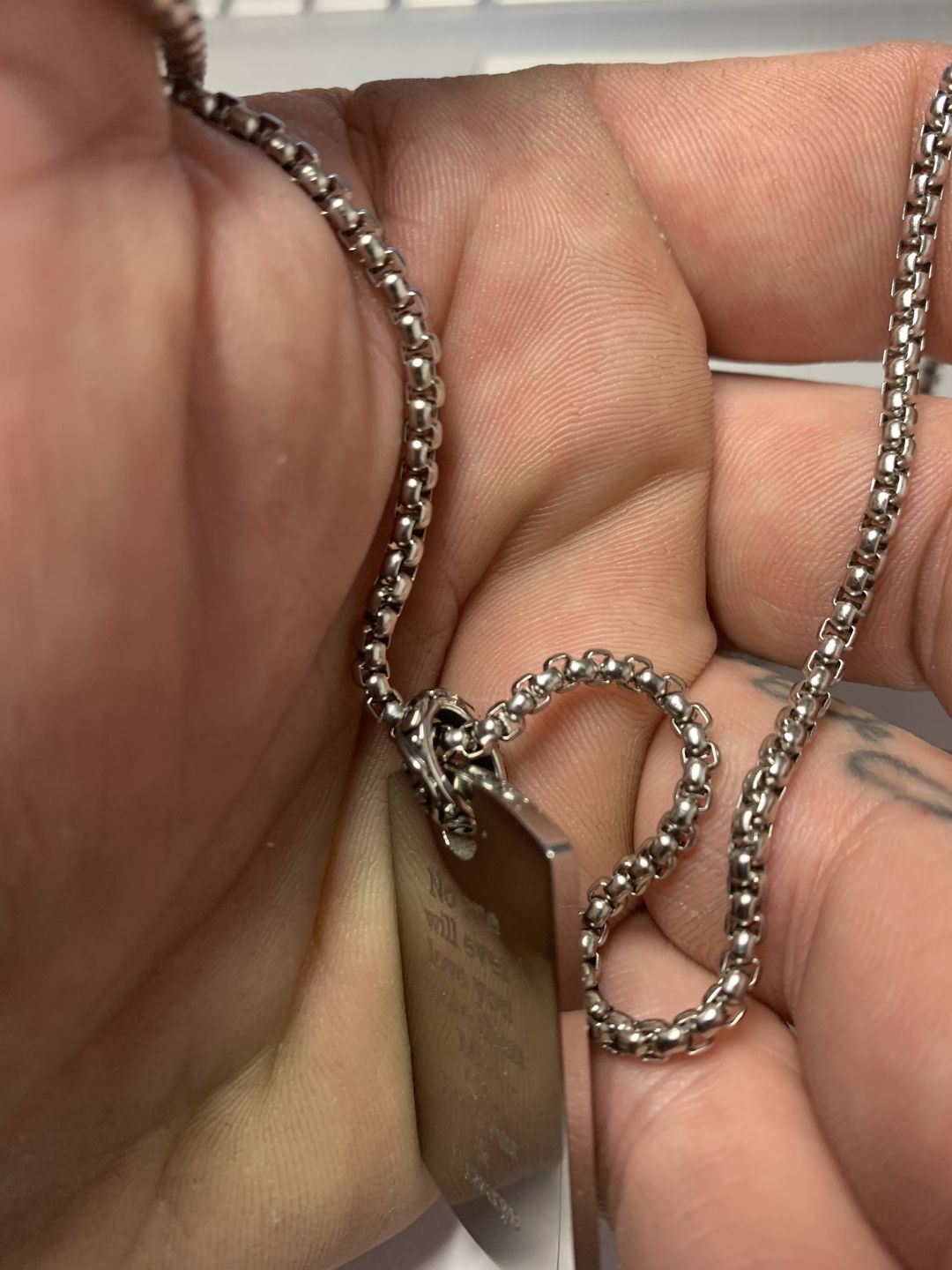 Customer photo review of Engravable Detailed Dog Tag