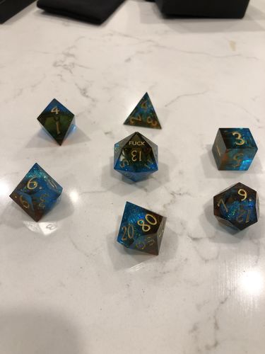 Customer photo review of Sharp Edge Blue Blood Resin DnD Dice Set YEET F*CK Dice