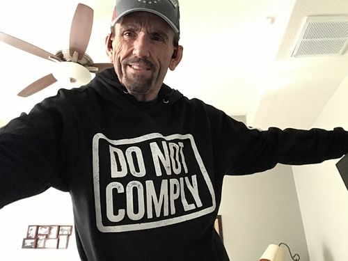Customer photo review of Do Not Comply Hoodie