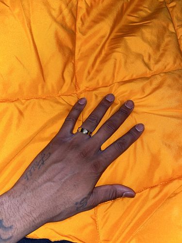 Customer photo review of 0.60 CTW Certified VVS1 Moissanite Designer Ring