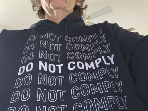 Customer photo review of Do Not Comply Hoodie
