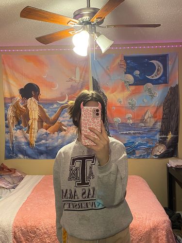 Customer photo review of Cute Devil Horns Cow/Leopard Leather Texture iPhone Case