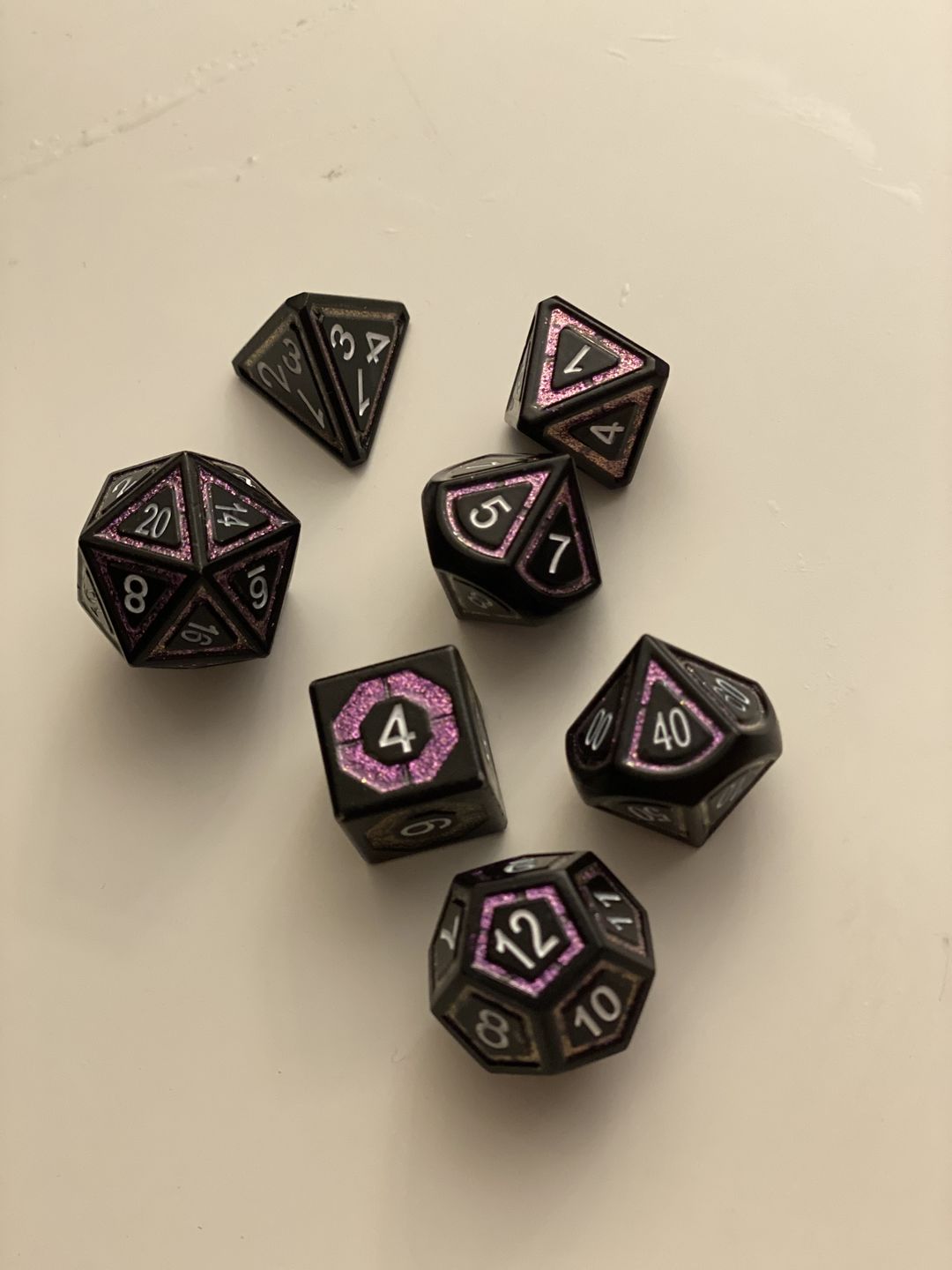 Customer photo review of CLERIC'S SHADOW DOMAIN PURPLE AND MATTE BLACK METAL DICE