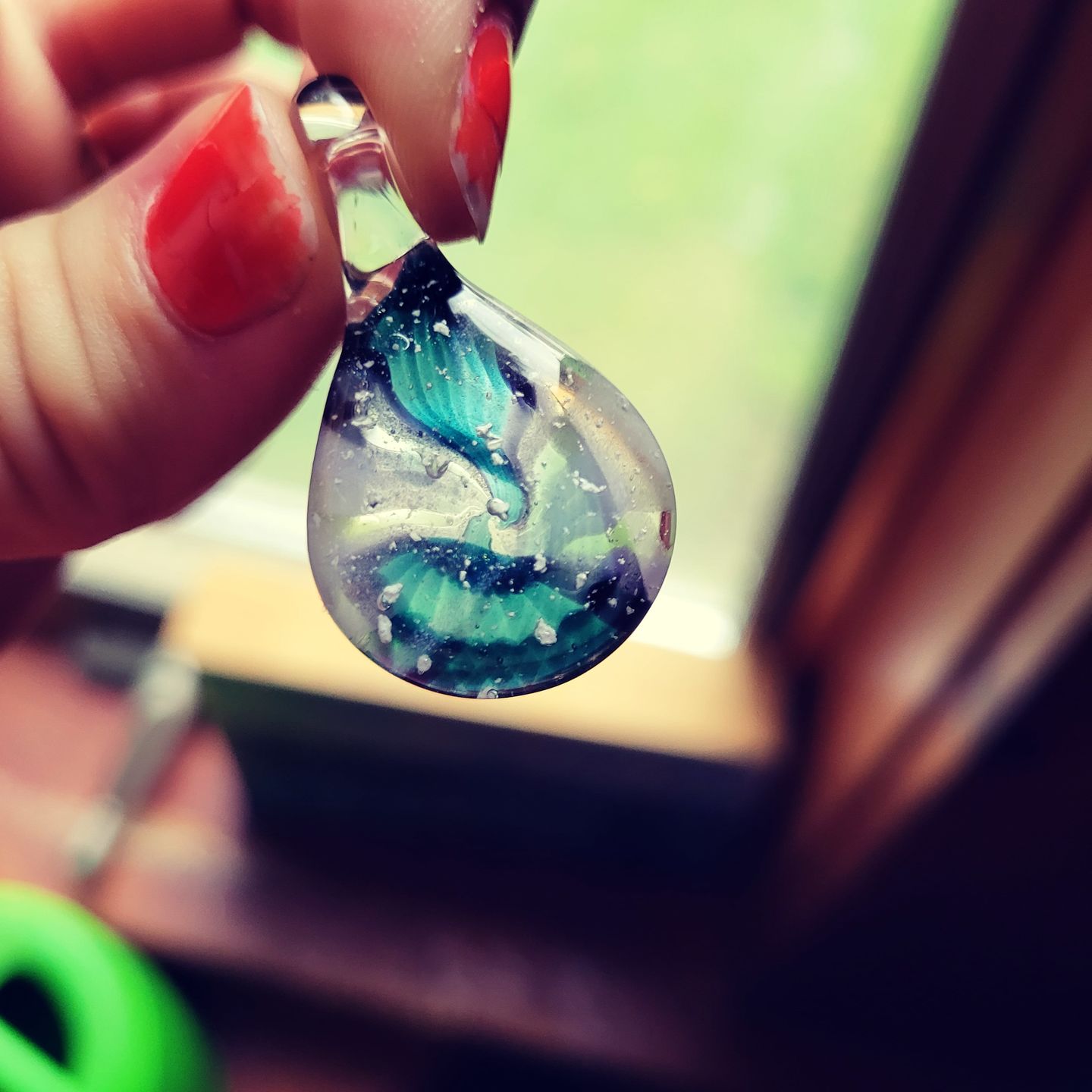 Customer photo review of Ocean Crash Pendant with Infused Cremation Ashes