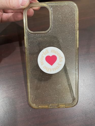 Customer photo review of The World Needs You Pop Socket