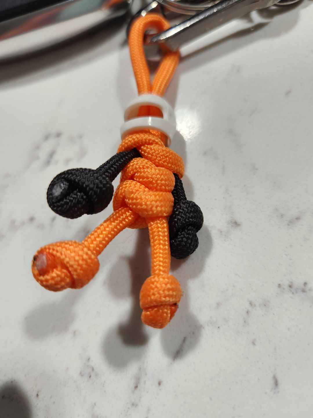 Customer photo review of Orange Biker Buddy Paracord Keychain