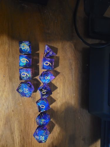 Customer photo review of Sharp Edge Purple Glitter Resin DnD Dice Set All Number Dice