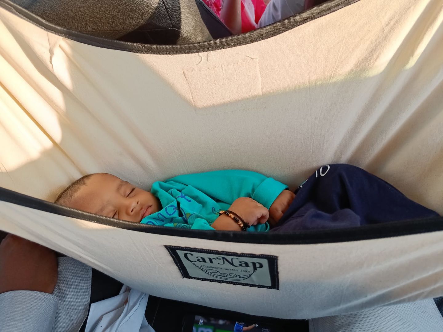 Customer photo review of CarNap - Portable Car Hammock for 0 to 2.5 year baby | with Adjustble Belt, Hammock Cloth, Hangers and Carry Bag