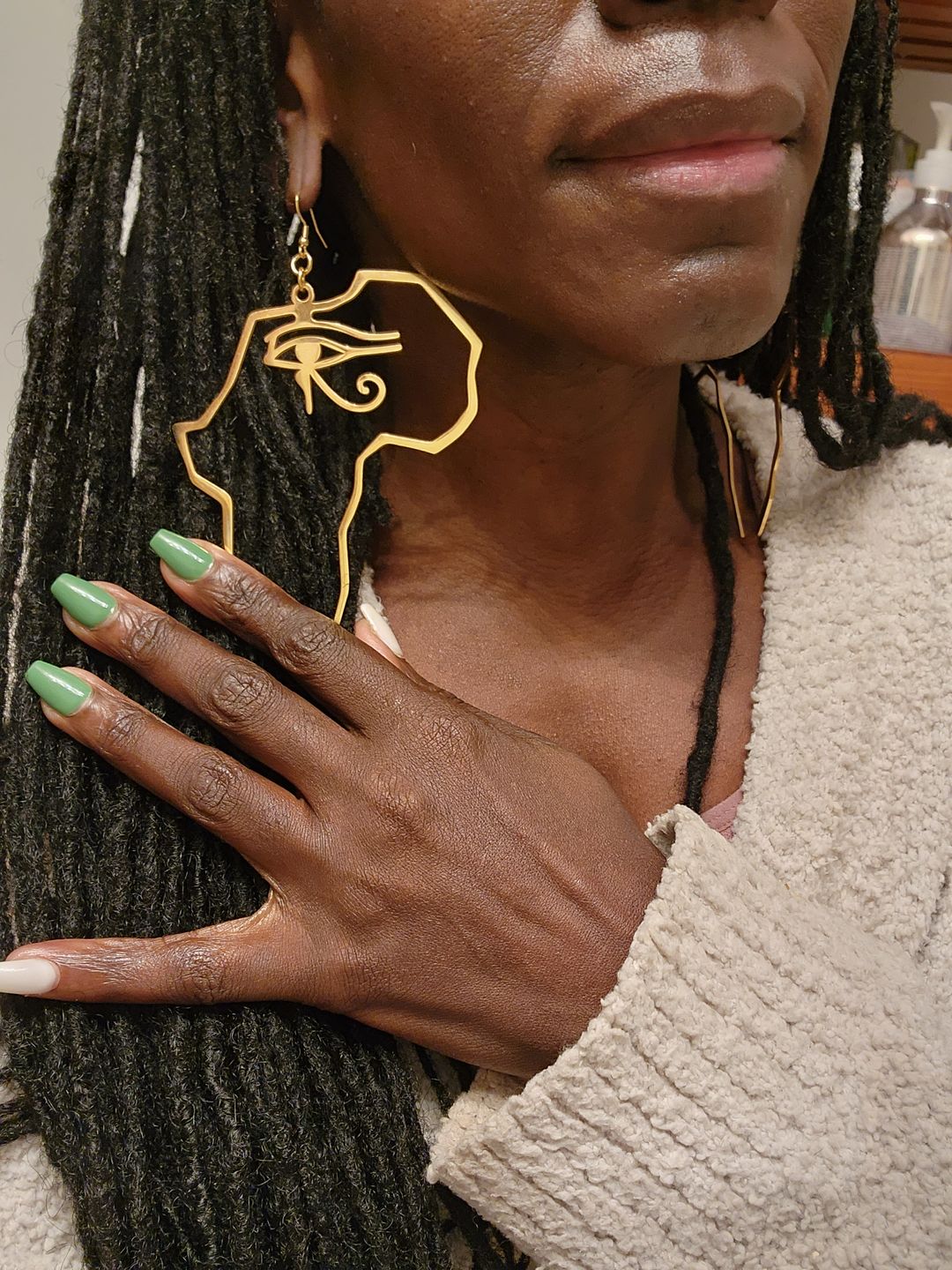 Customer photo review of African Map with Eye of Horus Symbol Earrings