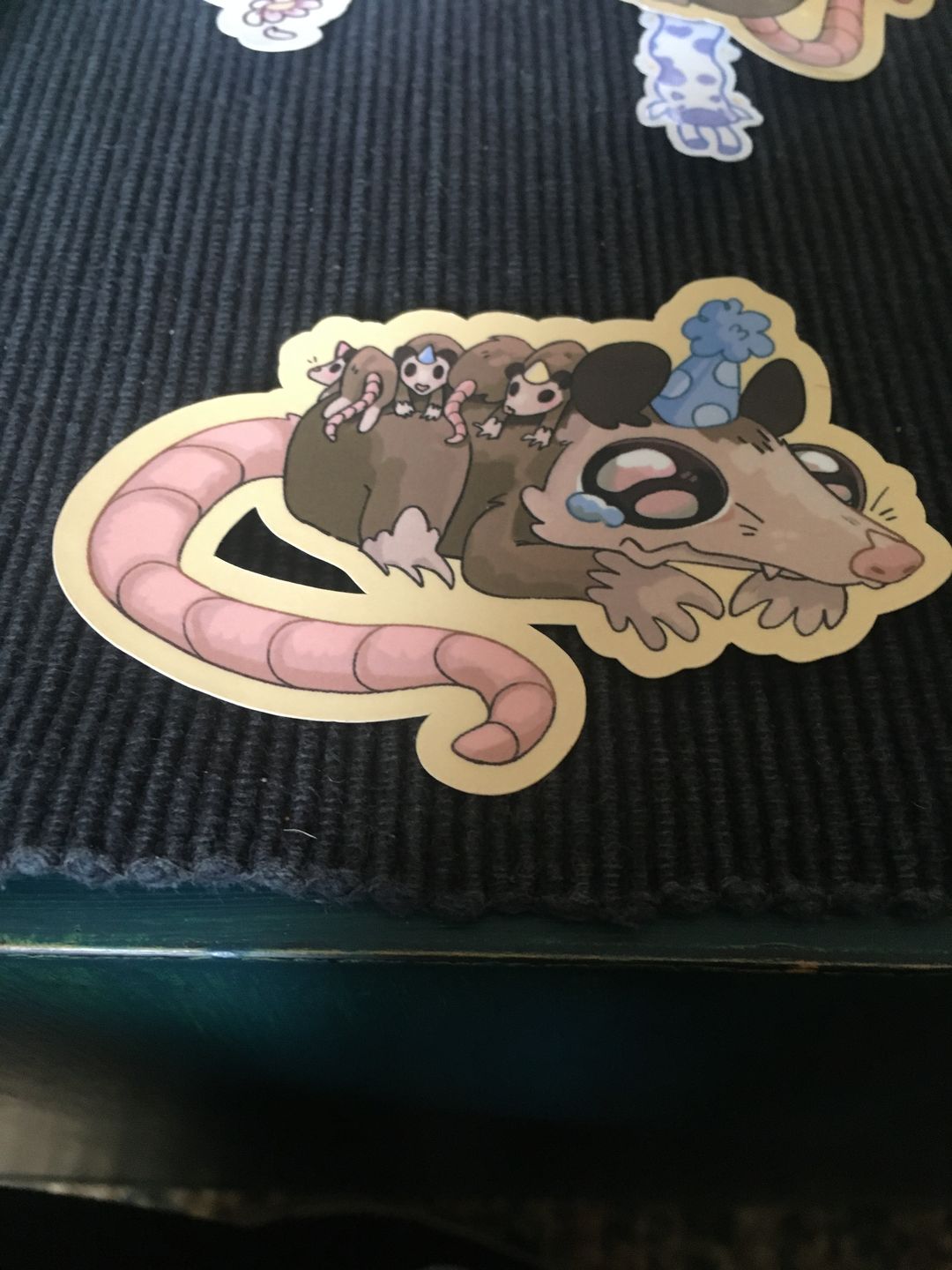 Customer photo review of Sad Party Opossum Stickers!