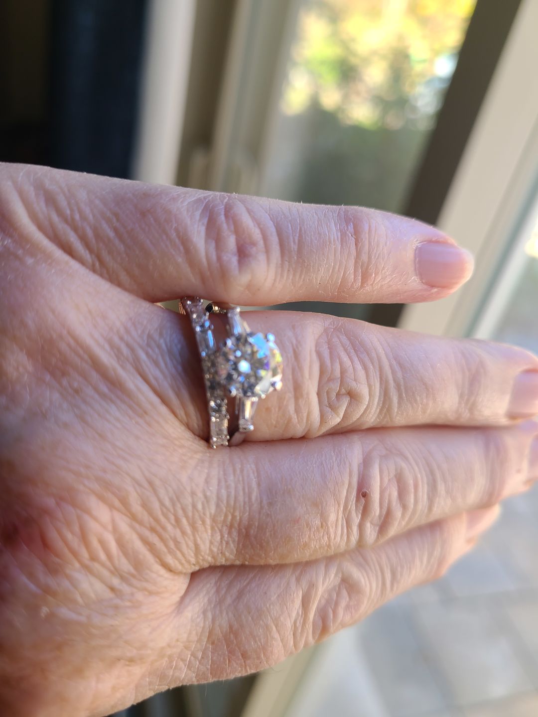 Customer photo review of Three Stone Round Moissanite Tapered Baguette Engagement Ring
